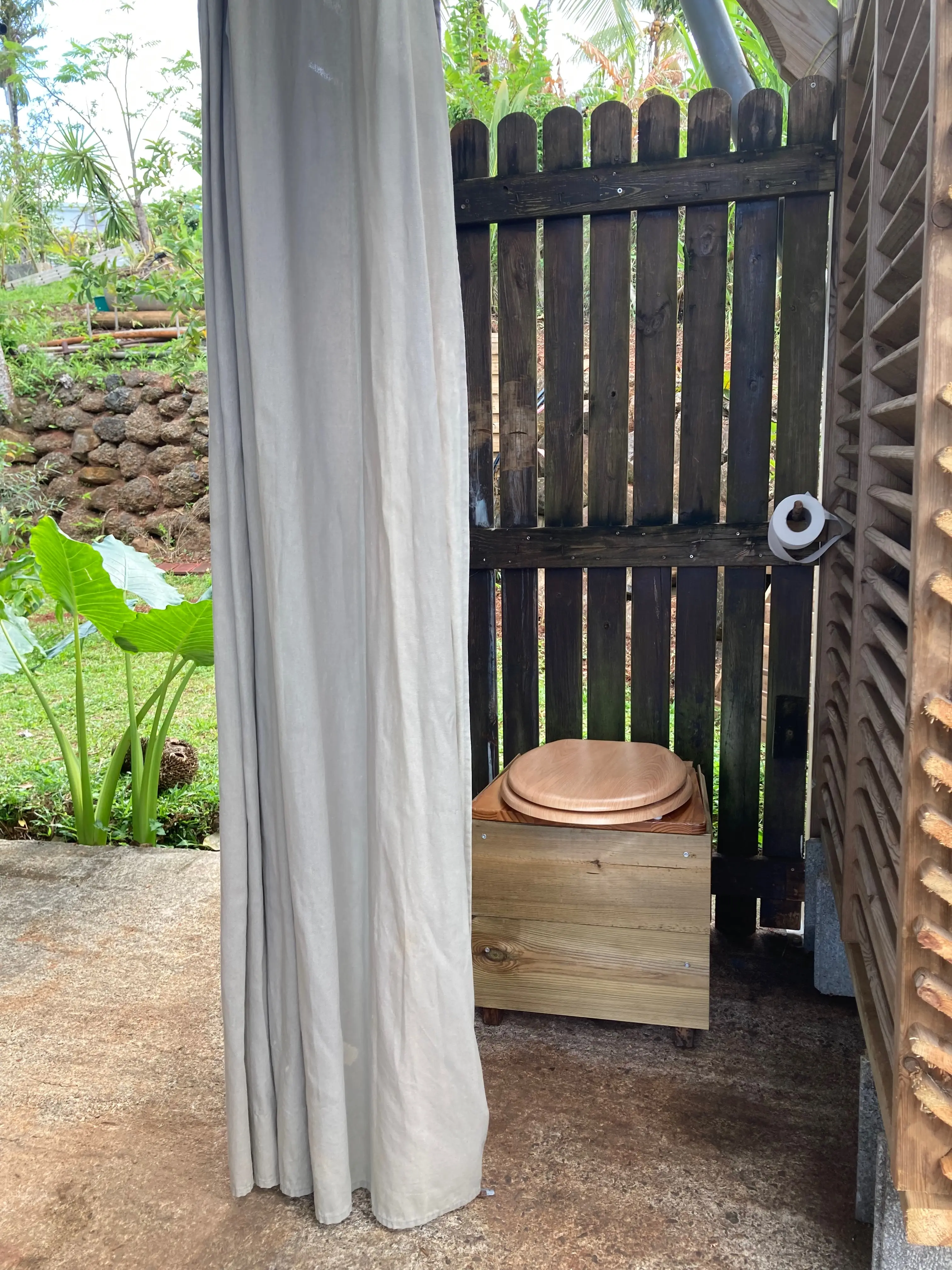 Wooden seat and box structure of the dry toilet at Les Vendredis